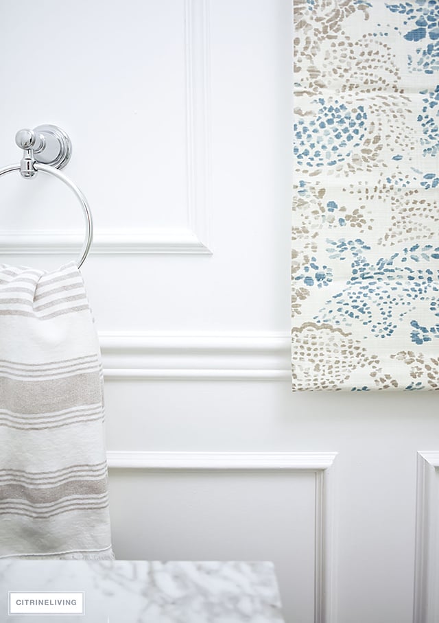 Our master bath makeover is almost finished! Gorgeous details - wall panelling, brass lighting + fixtures, custom window treatment and so much more!