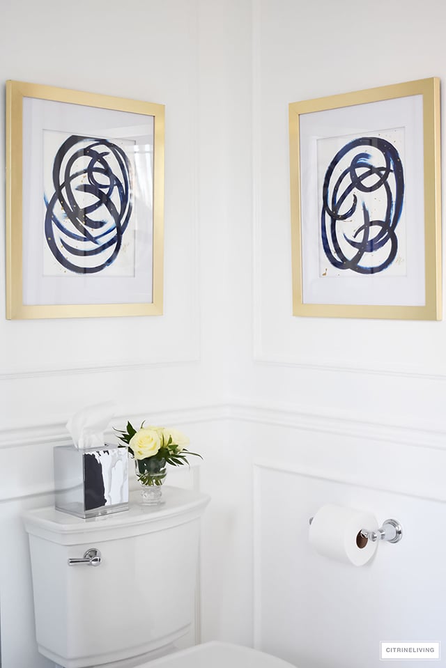 Gorgeous traditional meets modern master bathroom reveal with an elegant color palette of grey, white and brass, accented with blue and white chinoiserie.