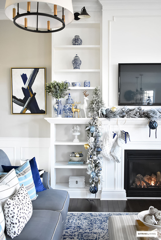Christmas Home Tour - Gorgeous living room dressed in blues, gold, silver and flocked greenery is sophisticated,elegant and has an elevated look and feel.