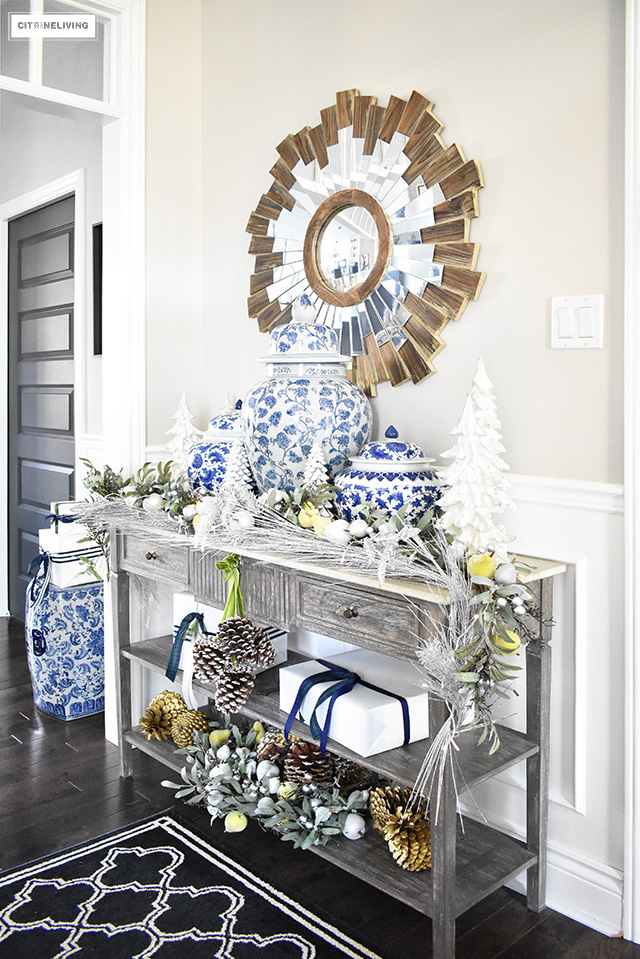 Beautiful Christmas home tour featuring the dining room and entryway dressed in blue, white, green and gold for the perfect holiday mix.