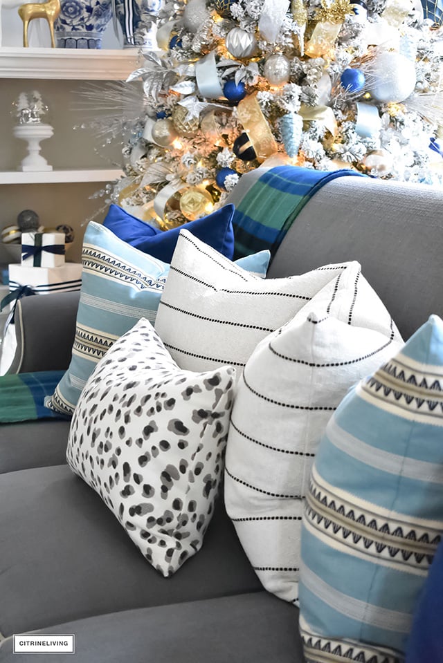 Christmas Home Tour - Gorgeous living room dressed in blues, gold, silver and flocked greenery is sophisticated,elegant and has an elevated look and feel.