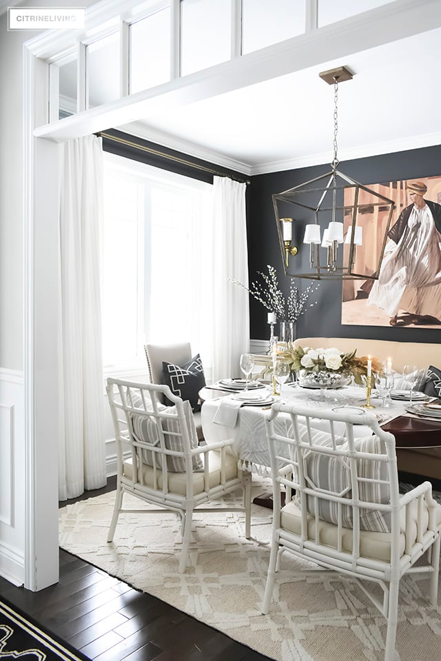 A gorgeous neutral Valentine's table with tones of white layered with metallic accents and a beautiful white rose centrepiece.