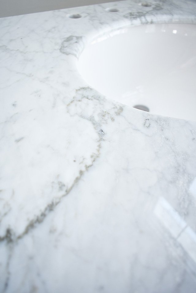 A classic white bathroom vanity with a marble top is the perfect addition to a small bath. Update and bathroom with this versatile piece for a clean and crisp look in your bathroom!