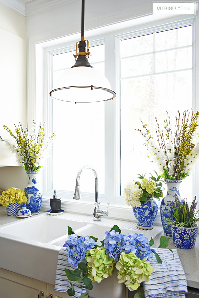 Elegant Spring decorating using pretty blue and vibrant yellow accents along with real and faux florals to help bring a sophisticated yet relaxed feel to your home.