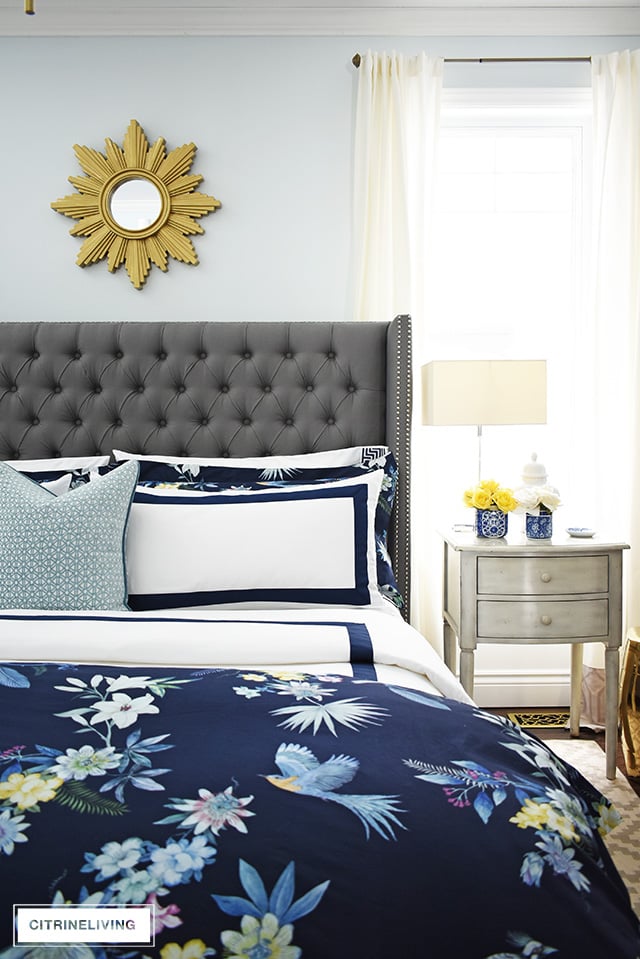 Classic white + navy hotel chic bedding is so gorgeous paired with this navy chinoiserie duvet and shams for a rich and elegant look in our bedroom.