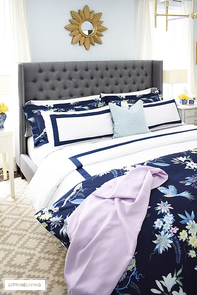 Classic white + navy hotel chic bedding is so gorgeous paired with this navy chinoiserie duvet and shams for a rich and elegant look in our bedroom.