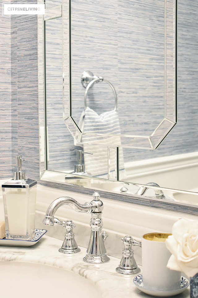 Our kids' bathroom gets a chic, coastal update with a classic white vanity and marble countertop for an elegant and traditional look.