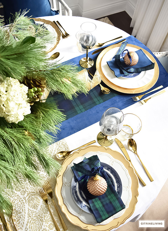 Classic blackwatch tartan in navy and green accented with gold create a stunning tablescape.