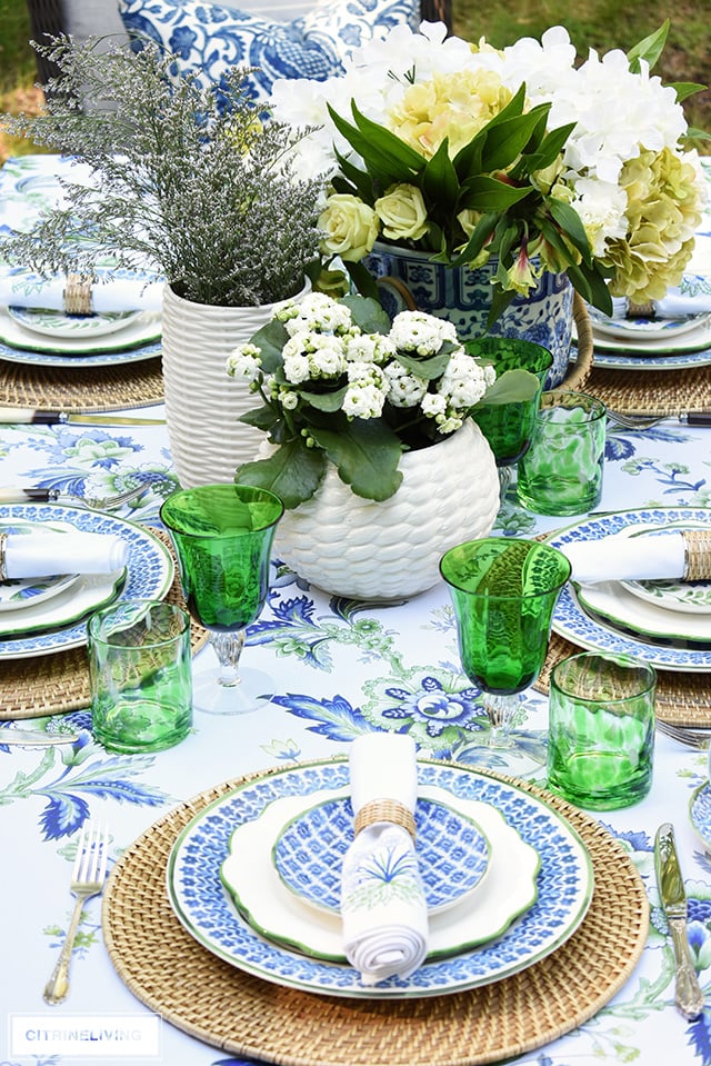 Gorgeous blue, white, and green elegant summer tablescape with a laid back look that's sophisticated and chic! See how to pull this look together for your summer entertaining.