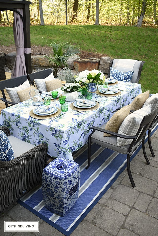 Gorgeous blue, white, and green elegant summer tablescape with a laid back look that's sophisticated and chic! See how to pull this look together for your summer entertaining.