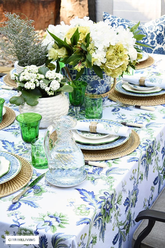 Gorgeous blue, white, and green elegant summer tablescape with a laid back look that's sophisticated and chic! See how to pull this look together for your summer entertaining.