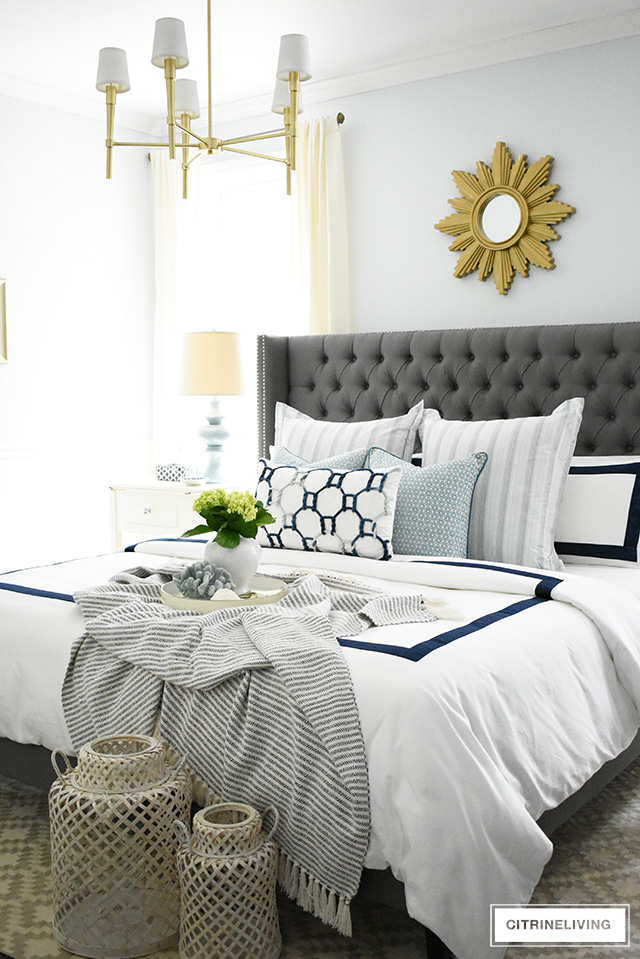 Adding summer touches to your bedroom is as simple as throw pillows, a casual throw, and some pretty coastal accents. Bring in the season with these these no-fail tips for a relaxing and airy summer bedroom!