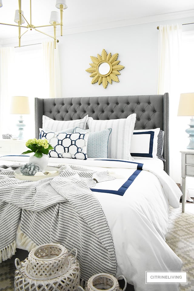 Adding summer touches to your bedroom is as simple as throw pillows, a casual throw, and some pretty coastal accents. Bring in the season with these these no-fail tips for a relaxing and airy summer bedroom!