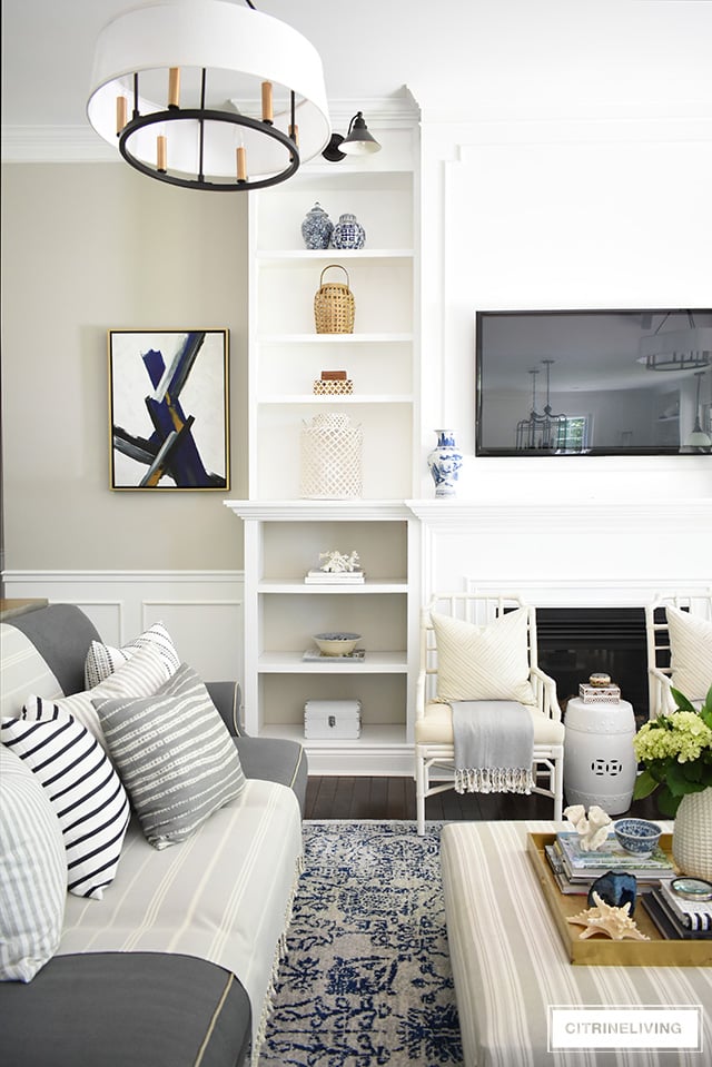 Create a casual and elegant summer living room with calming neutrals, layers of textures and hints on blue and white for a relaxing, laid-back look.