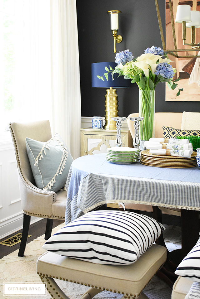 Bring a laid-back feel to your dining room with a collection of your favorite accessories, dishes and linens layered on your table for a curated look!