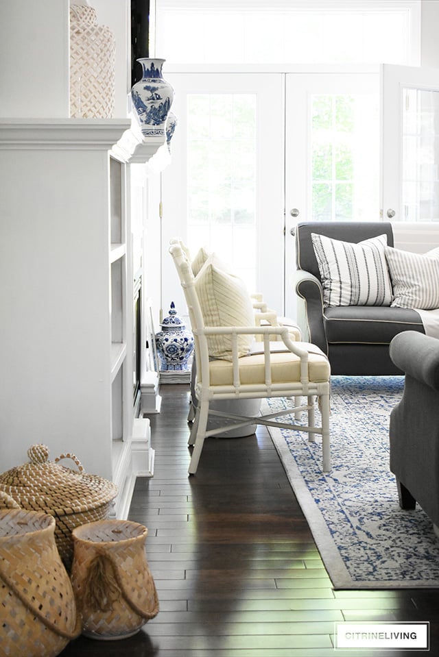 Create a casual and elegant summer living room with calming neutrals, layers of textures and hints on blue and white for a relaxing, laid-back look.