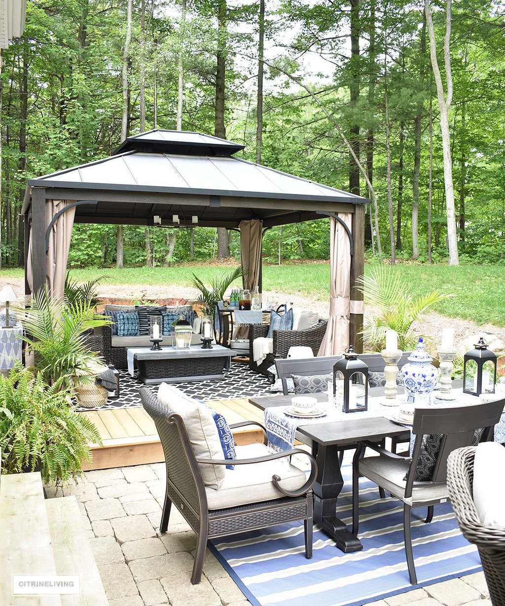 Outdoor patio makeover with large gazebo, dining area and lounge zone.