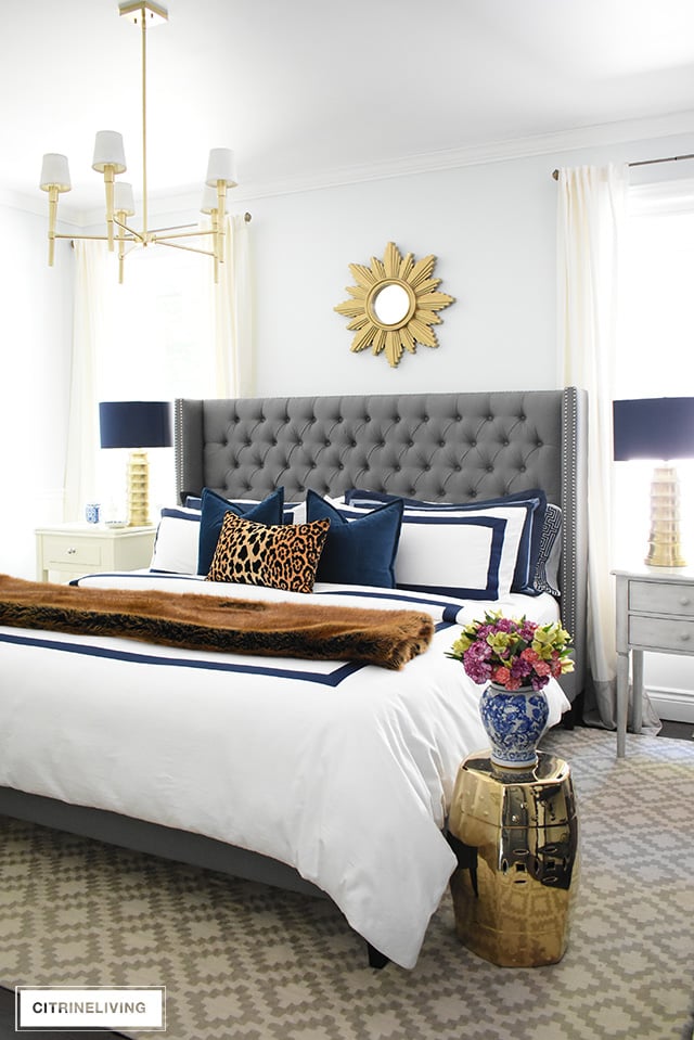 Fall bedroom decor with navy, leopard and faux fur - easy tips to transform your room for less than $20! By CitrineLiving #fallbedroomdecor #bedroom #fallbedroom #falldecor #falldecorating #falldecoratingideas #bedroomdecor #masterbedroom 