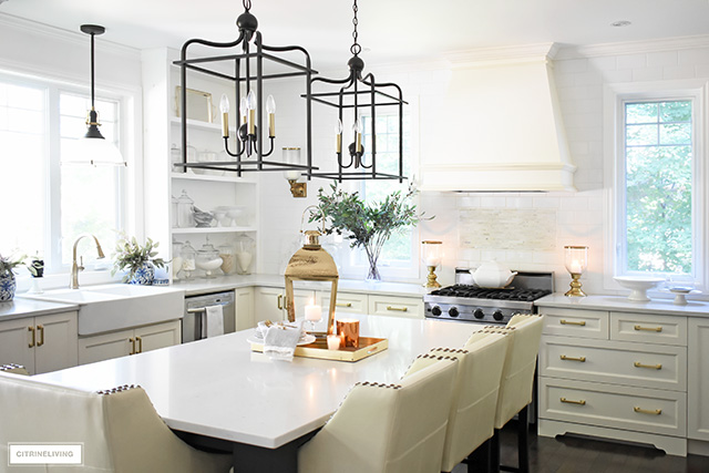 Fall kitchen decorating that is simple yet beautiful - warm metals, simple greenery and a just a few accessories for gorgeous pared-back style.