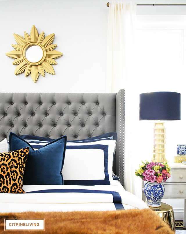 Fall bedroom decor with navy, leopard and faux fur - easy tips to transform your room for less than $20! By CitrineLiving #fallbedroomdecor #bedroom #fallbedroom #falldecor #falldecorating #falldecoratingideas #bedroomdecor #masterbedroom 