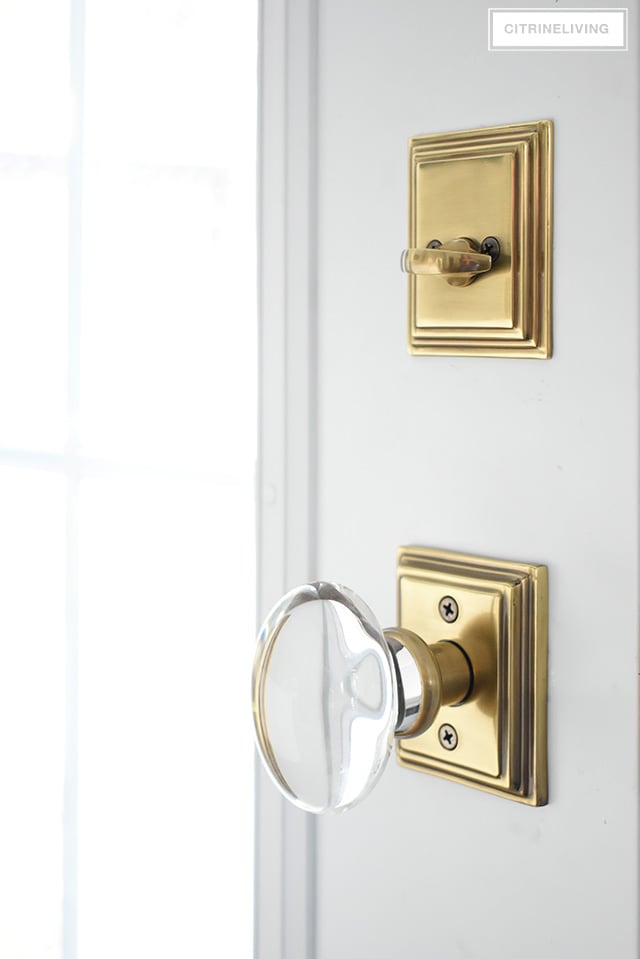 Gorgeous French Antique brass hardware from Emtek featuring Hampton glass knob, and Wilshire rosette and deadbolt.