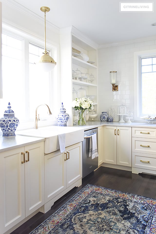 w kitchen lighting and barstools + a vintage style rug add character and tailored elegance to our kitchen, it's a chic and sophisticated mix!