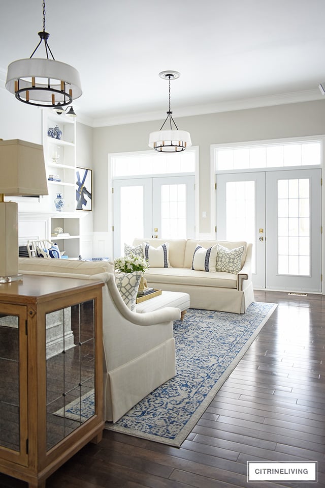 Gorgeous new white sofas completely transform this living room into a bright, airy and sophisticated space!