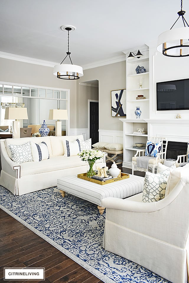 Gorgeous new white sofas completely transform this living room into a bright, airy and sophisticated space!