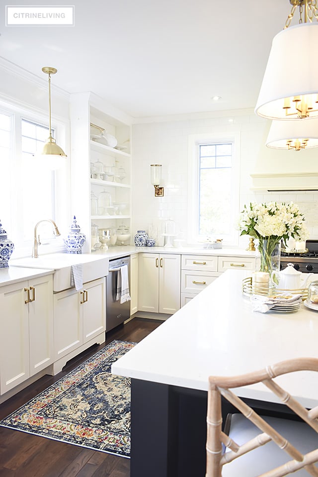 w kitchen lighting and barstools + a vintage style rug add character and tailored elegance to our kitchen, it's a chic and sophisticated mix!