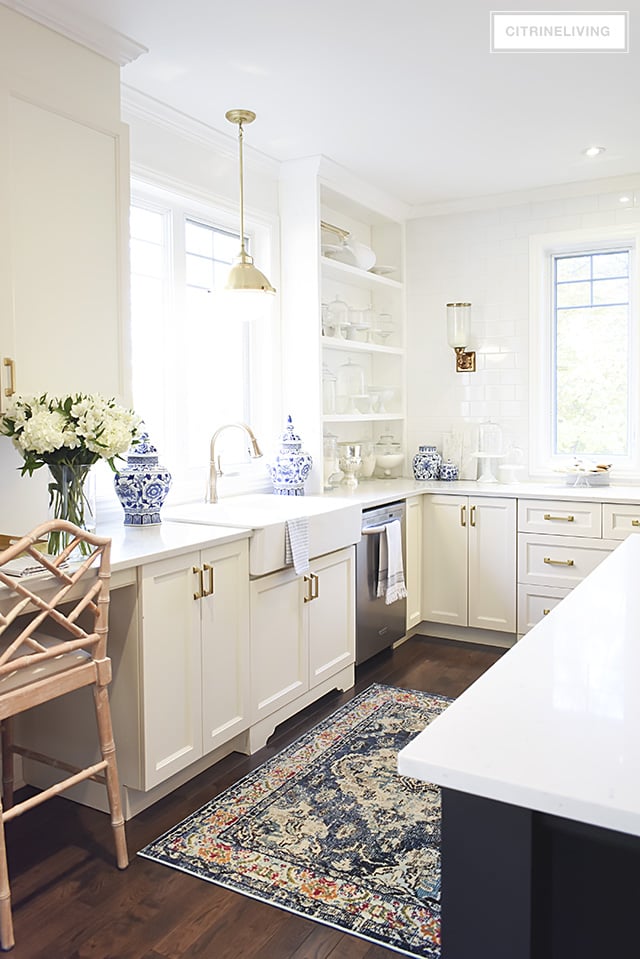 w kitchen lighting and barstools + a vintage style rug add character and tailored elegance to our kitchen, it's a chic and sophisticated mix!