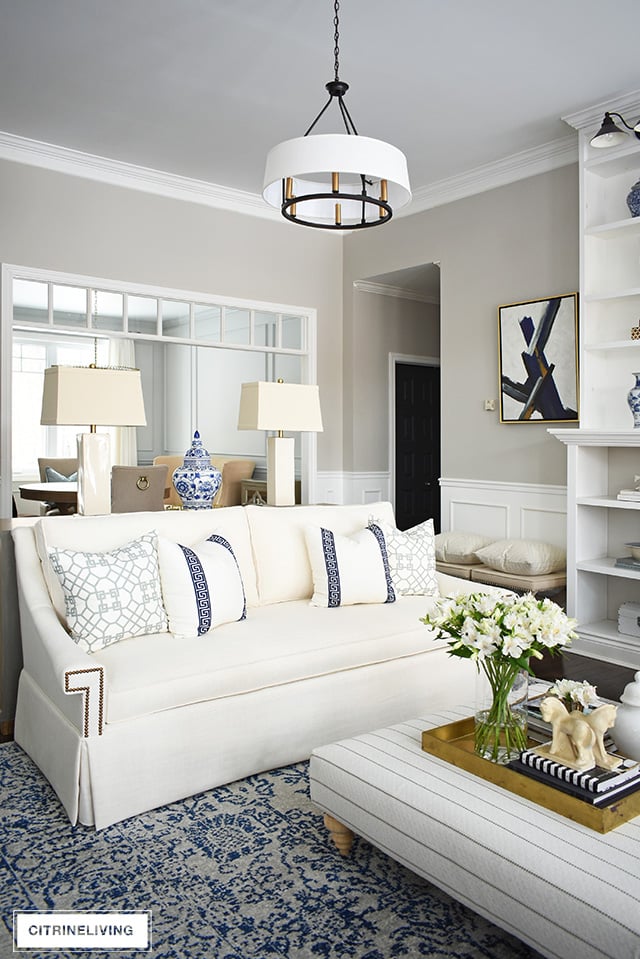 Stunning living room makeover with elegant white sofas - this space is sophisticated and refined yet still casual and welcoming!