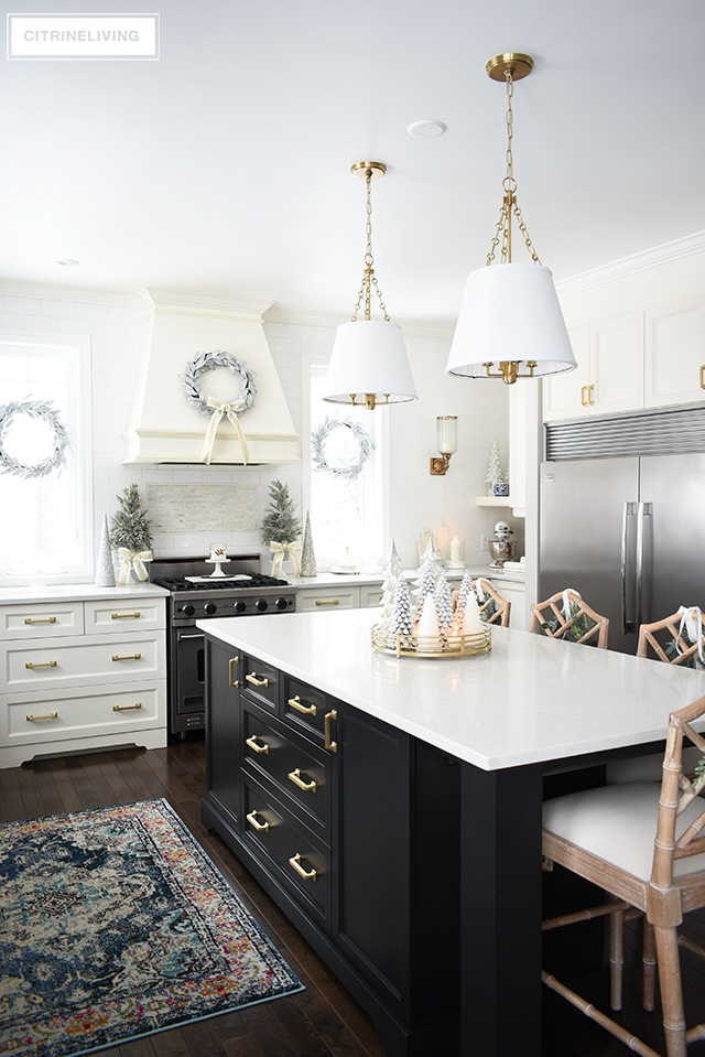 Christmas kitchen decorating using silver and gold mixed with touches of holiday greenery is the perfect mix of elegant and chic.