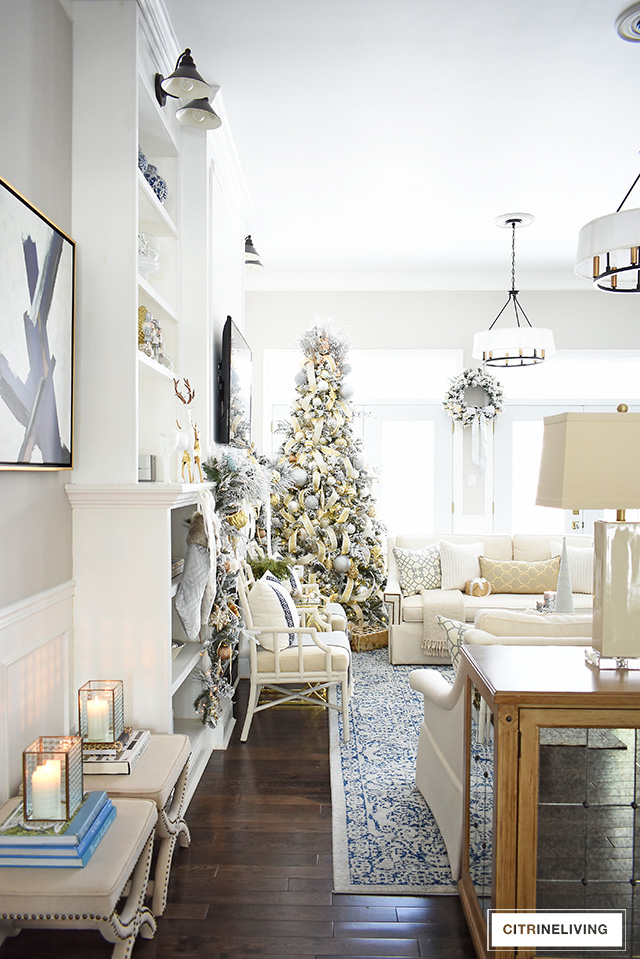 Create a stunning Christmas decorated living room with silver and gold accents for a sophisticated and glamorous space.