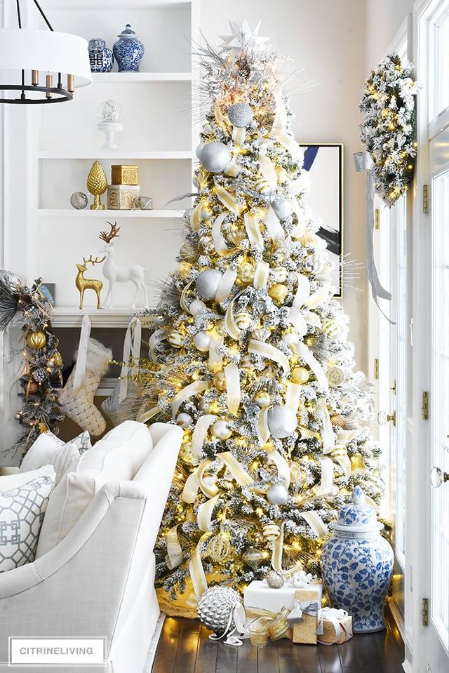 Flocked white Christmas tree with all white and silver decorations