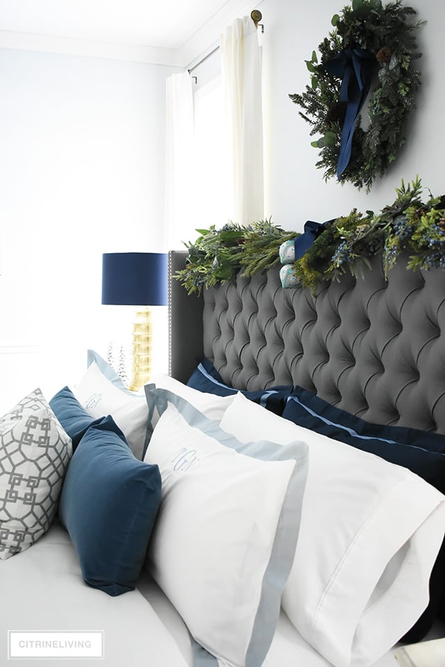 Create a gorgeous, luxurious Christmas bedroom you'll never want to leave with beautiful bedding and festive holiday greenery!