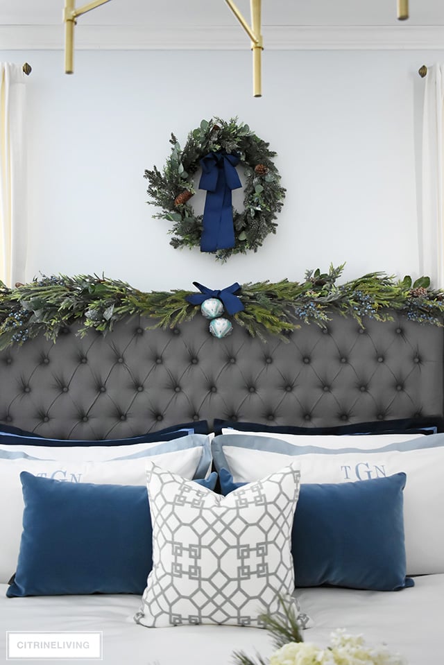 Create a gorgeous, luxurious Christmas bedroom you'll never want to leave with beautiful bedding and festive holiday greenery!