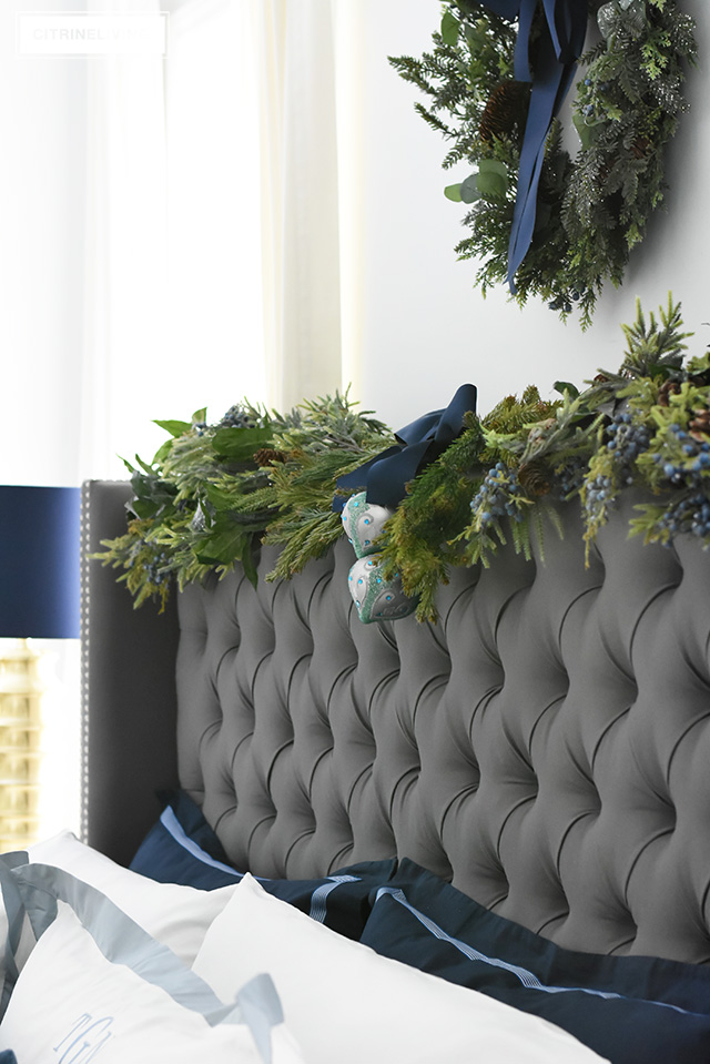 Create a gorgeous, luxurious Christmas bedroom you'll never want to leave with beautiful bedding and festive holiday greenery!
