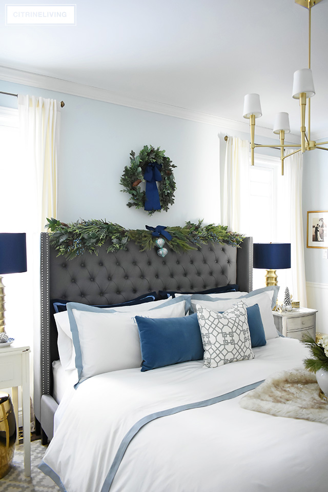Create a gorgeous, luxurious Christmas bedroom you'll never want to leave with beautiful bedding and festive holiday greenery!