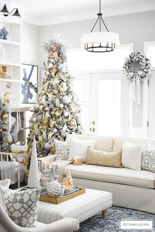 Gorgeous flocked Christmas tree + garland, dressed in magical silver and gold!