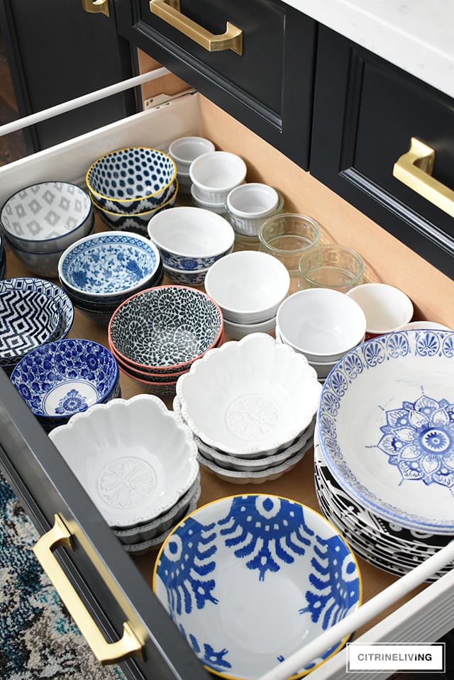 Organized kitchen drawers, bowl and plates