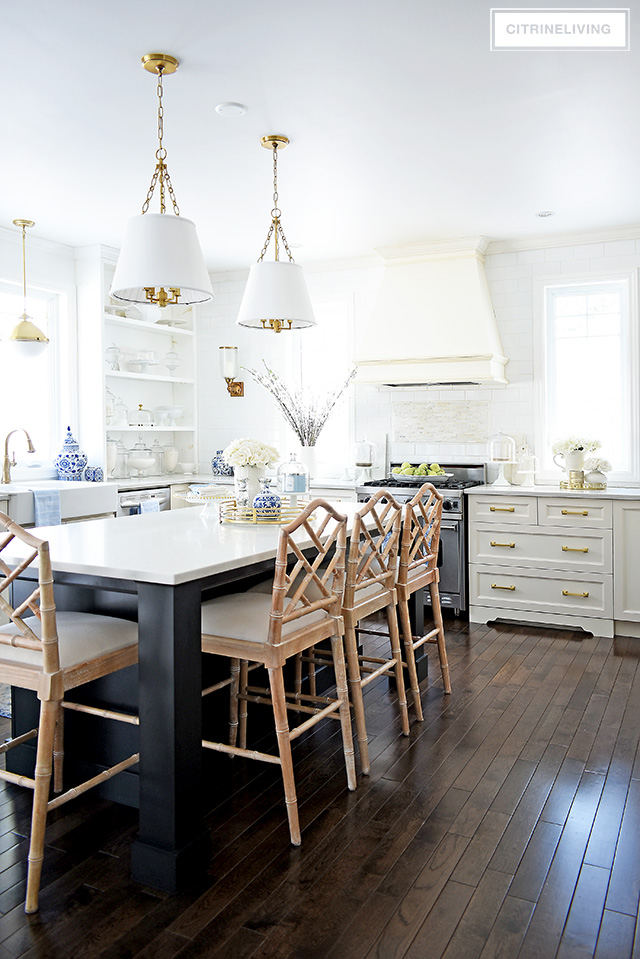 Spring kitchen decorating ideas - gorgeous white kitchen with blue and white accents, faux florals and light blue touches.