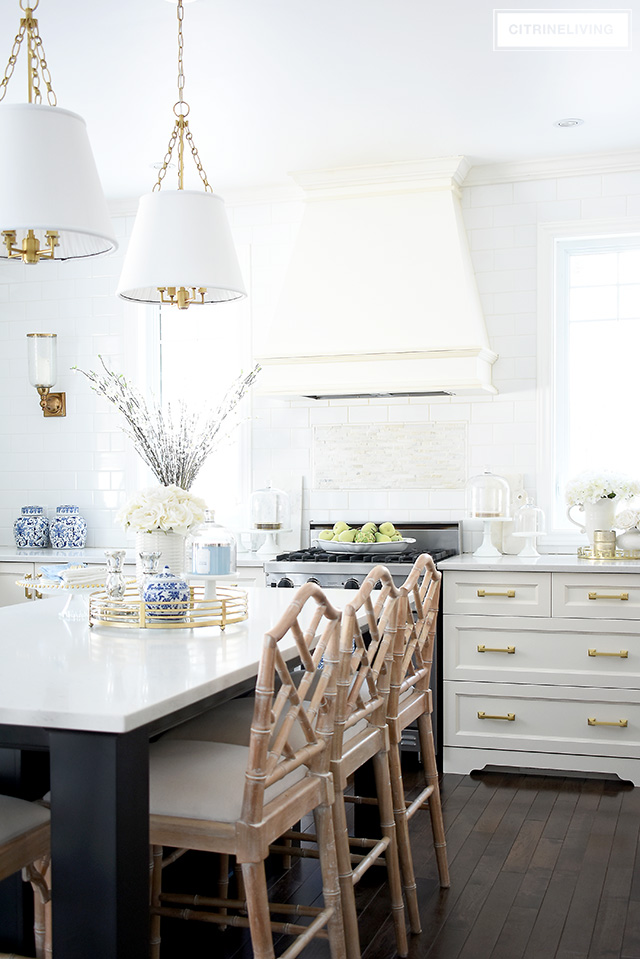 Gorgeous kitchen with spring accents - faux florals, blue and white accessories and light blue touches.