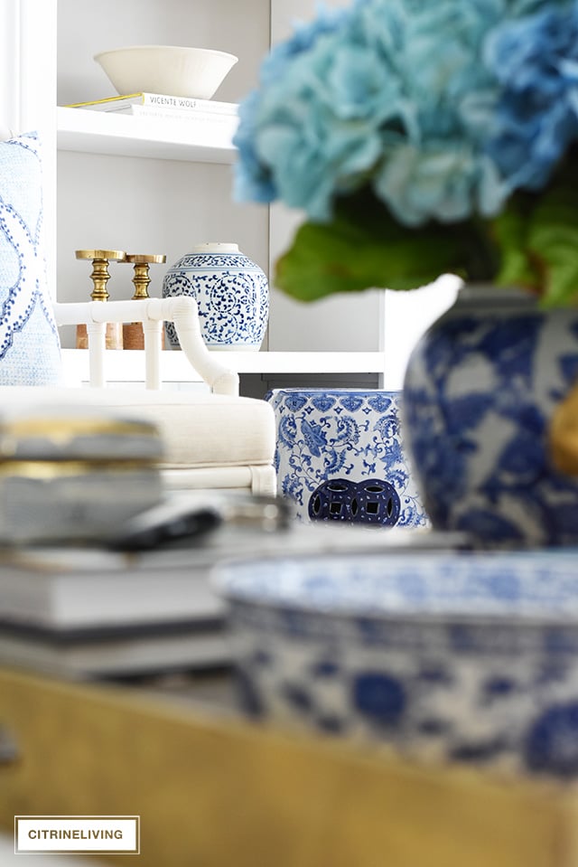 Beautiful and bright spring living room decorating in blue, white and brass plus our new gorgeous brass chandeiers and wall sconces!