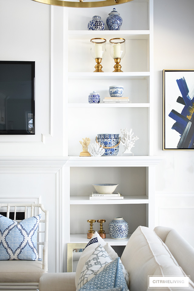 Styling shelves can be tricky! I'm sharing how to decorate bookshelves with simple ideas that you can use to create a gorgeous spring-styled space!