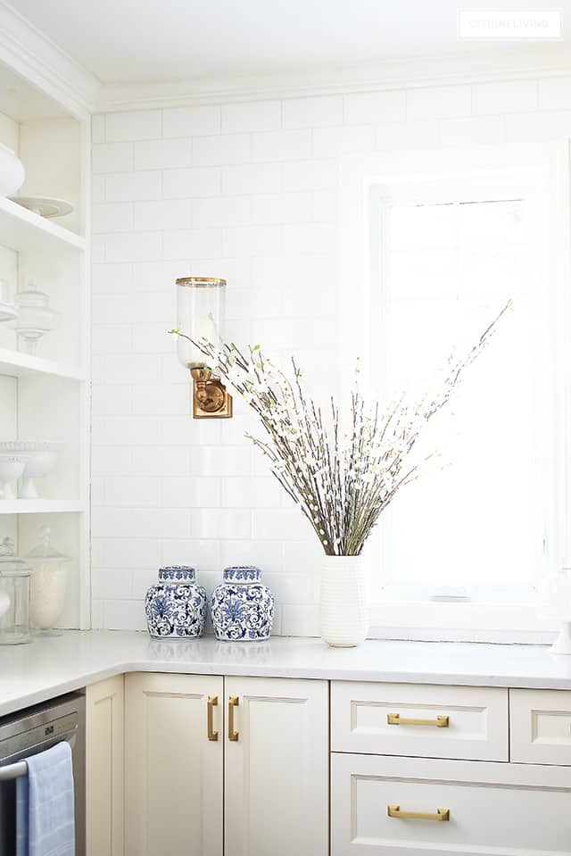 Spring kitchen decorating ideas - beautiful cherry blossoms paired with blue and white ginger jars.