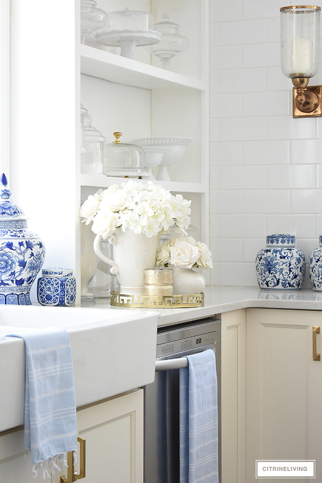 Spring kitchen decorating - add gorgeous faux flowers in soft whites and creams for an elegant touch.