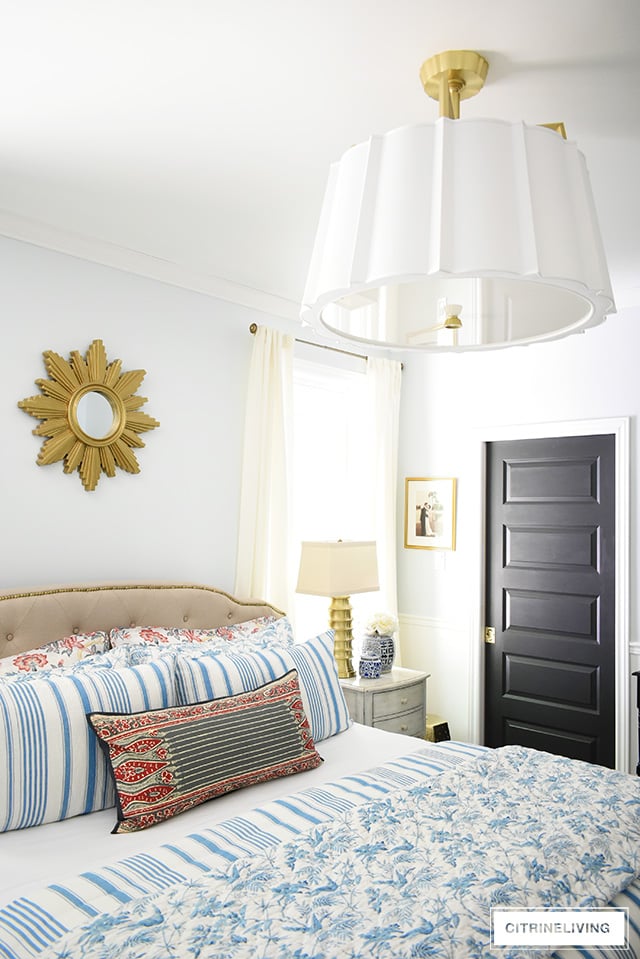 Bedroom refresh featuring a dramatic over-scale drum shade chandelier with elegant detailing and brass accents.