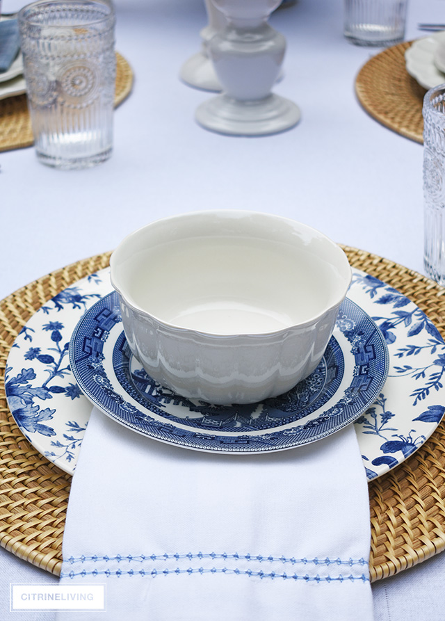 Vintage inspired outdoor late summer tablescape with blue and white dishes.