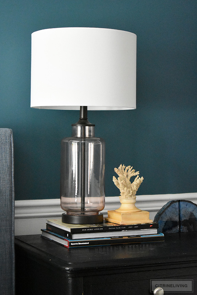 Modern coastal teen bedroom - Beautiful glass lamp, styled with coral and agate for a clean, coastal feel.
