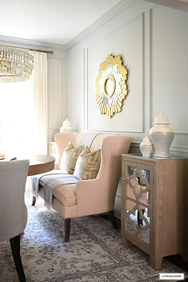 Chic + elegant dining room decor - use settee with luxe velvet pillows to welcome guests.